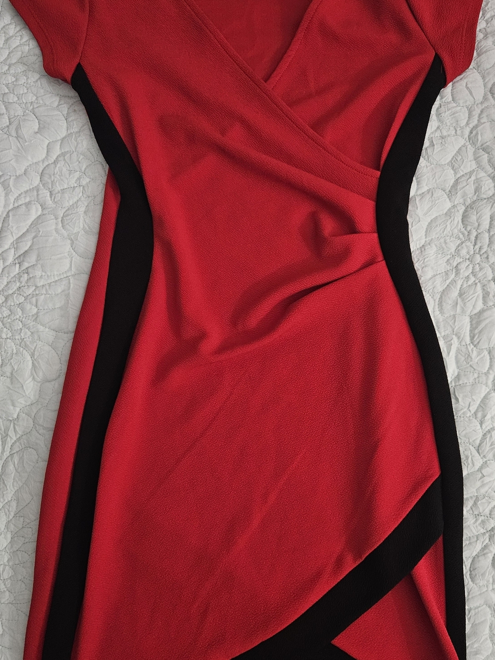 Almost Famous red and black dress features a flattering V-neckline and a modern